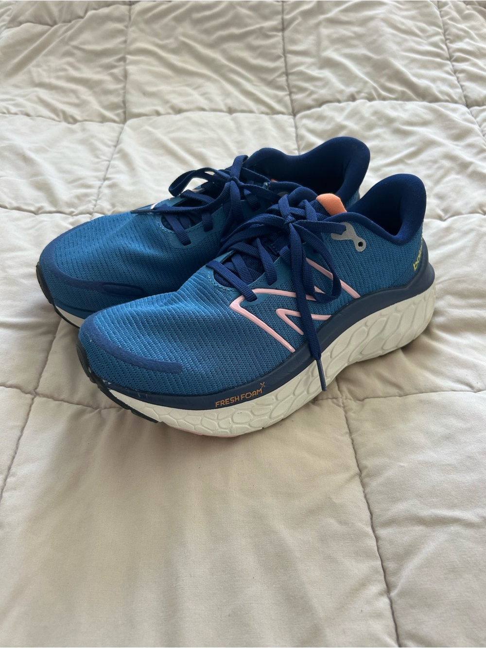 New Balance Blue Athletic Running Shoes with Pink Accents